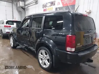 2011 Dodge Nitro Heat with VIN 1D4PU4GK1BW602572, listed as a IAAI auction lot 41529030 with 134,482 mi miles. Bid and sale history available at carsss.com. Image 3.