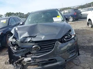 2016 Mazda CX-5 Grand Touring z VIN JM3KE4DY5G0836891, wystawiony jako IAAI lot #41441065 z przebiegiem 120 808 mil mil oraz . Historia ofert i sprzedaży dostępna na DreamBid. Obrazek 12.