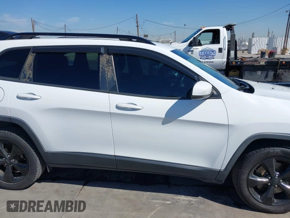 2016 Jeep Cherokee 75th Anniversary with VIN 1C4PJLCB9GW107422, listed as a IAAI auction lot 41997941 with 121,641 mi miles and . Bid and sale history available at DreamBid. Image 13.
