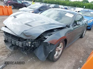 2021 Ford Mustang EcoBoost with VIN 1FA6P8TH9M5133781, listed as a IAAI auction lot 42158034 with 31,648 mi miles and . Bid and sale history available at DreamBid. Image 2.