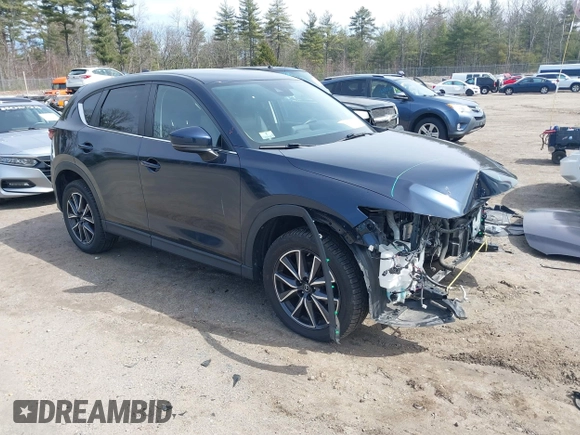 2018 Mazda CX-5 Touring z VIN JM3KFBCM4J0379871, wystawiony jako IAAI lot #41865130 z przebiegiem 48 674 mil mil oraz . Historia ofert i sprzedaży dostępna na DreamBid. Obrazek 1.