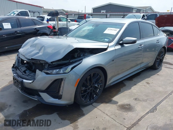 2023 Cadillac CT5 Sport z VIN 1G6DP5RK7P0113696, wystawiony jako IAAI lot #41904906 z przebiegiem 89 191 mil mil oraz . Historia ofert i sprzedaży dostępna na DreamBid. Obrazek 2.