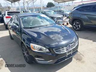 2016 Volvo S60 T5 Drive-E Premier z VIN LYV402FK3GB089890, wystawiony jako IAAI lot #42249395 z przebiegiem 98 100 mil mil oraz . Historia ofert i sprzedaży dostępna na DreamBid. Obrazek 1.