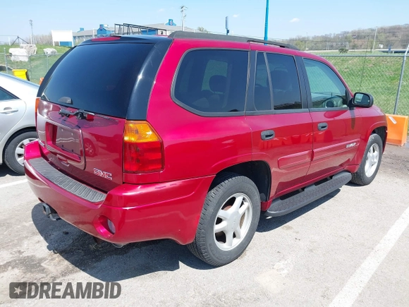 2005 GMC Envoy SLT with VIN 1GKDS13SX52144959, listed as a IAAI auction lot 41968495 with 238,199 mi miles. Bid and sale history available at carsss.com. Image 4.