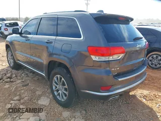 2015 Jeep Grand Cherokee Summit with VIN 1C4RJFJG8FC679185, listed as a IAAI auction lot 41653531 with 158,186 mi miles and . Bid and sale history available at DreamBid. Image 3.