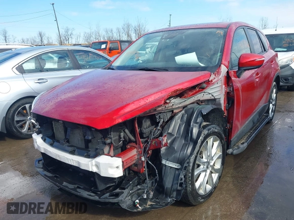 2015 Mazda CX-5 Grand Touring with VIN JM3KE4DY7F0477770, listed as a IAAI auction lot 41617849 with 106,135 mi miles. Bid and sale history available at carsss.com. Image 6.