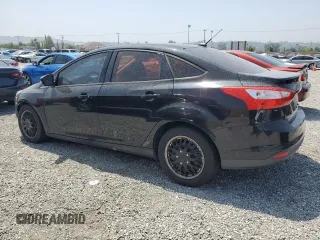 2012 Ford Focus SE with VIN 1FAHP3F22CL372232, listed as a Copart auction lot 59637645 with 134,337 mi miles and Salvage title. Bid and sale history available at DreamBid. Image 2.