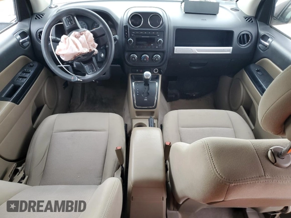 2014 Jeep Compass Sport with VIN 1C4NJCBA5ED844934, listed as a Copart auction lot 52774945 with 148,897 mi miles and Salvage Title. Bid and sale history available at carsss.com. Image 8.