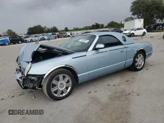 2004 Ford Thunderbird Deluxe with VIN 1FAHP60A44Y111156, listed as a Copart auction lot 79000014 with 42,101 mi miles and Salvage Title. Bid and sale history available at carsss.com. Image 1.