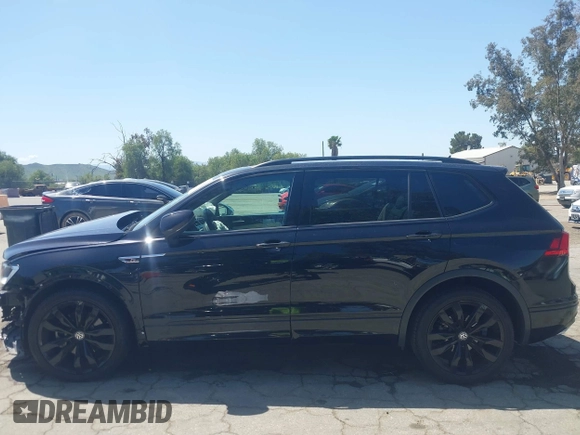 2021 Volkswagen Tiguan SE with VIN 3VV3B7AX0MM015825, listed as a IAAI auction lot 41955268 with 57,909 mi miles and . Bid and sale history available at DreamBid. Image 14.
