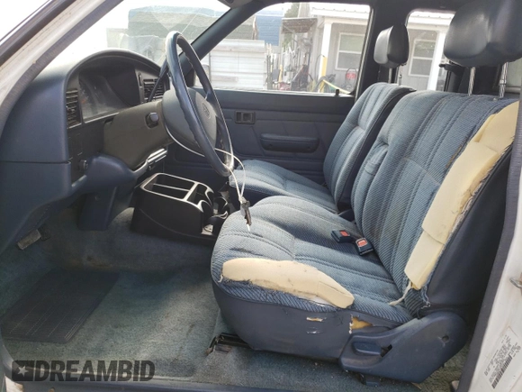1993 Toyota Pickup DLX z VIN JT4RN93P7P5074129, wystawiony jako Copart lot #72893054 z przebiegiem 235 053 mil mil oraz Szkoda całkowita • Salvage title. Historia ofert i sprzedaży dostępna na DreamBid. Obrazek 7.