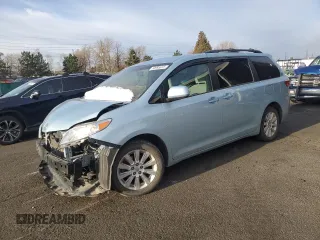 2015 Toyota Sienna LE with VIN 5TDJK3DC7FS123319, listed as a Copart auction lot 50993615 with 103,304 mi miles and Salvage title. Bid and sale history available at DreamBid. Image 1.