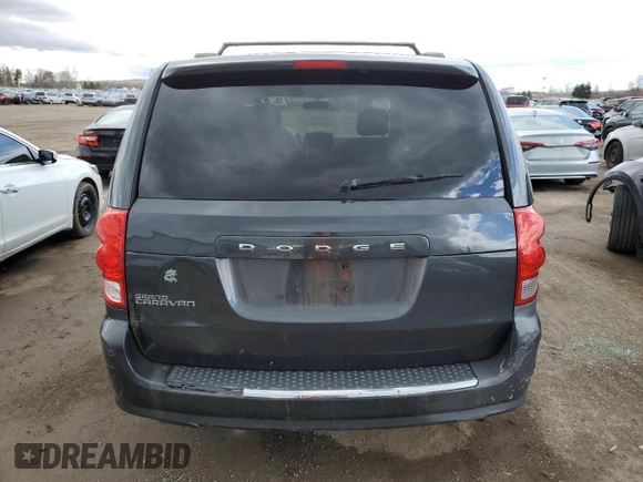 2012 Dodge Grand Caravan SE with VIN 2C4RDGBG5CR397651, listed as a Copart auction lot 52878905 with 248,103 mi miles and Clean Title. Bid and sale history available at DreamBid. Image 6.
