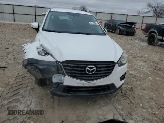2016 Mazda CX-5 Touring with VIN JM3KE2CY9G0733933, listed as a Copart auction lot 45118885 with 149,901 mi miles and Salvage Title. Bid and sale history available at carsss.com. Image 5.