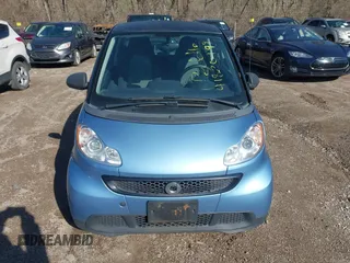 2013 Smart fortwo Pure z VIN WMEEJ3BA5DK672416, wystawiony jako IAAI lot #41820199 z przebiegiem 75 875 mil mil oraz . Historia ofert i sprzedaży dostępna na DreamBid. Obrazek 6.
