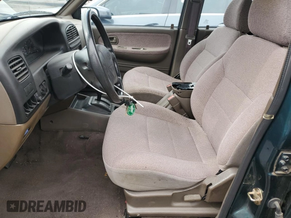 1999 Kia Sportage with VIN KNDJB7232X5612065, listed as a Copart auction lot 47575445 with 77,486 mi miles and Clean Title. Bid and sale history available at carsss.com. Image 7.