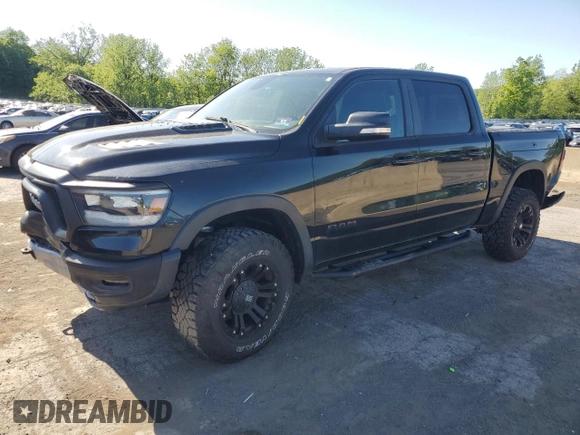 2019 Ram 1500 Rebel z VIN 1C6SRFLT5KN811457, wystawiony jako Copart lot #57034285 z przebiegiem 84 077 mil mil oraz Szkoda całkowita • Salvage title. Historia ofert i sprzedaży dostępna na DreamBid. Obrazek 1.