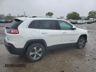 2019 Jeep Cherokee Limited z VIN 1C4PJMDXXKD409564, wystawiony jako Copart lot #60893225 z przebiegiem 128 674 mil mil oraz Szkoda całkowita • Salvage title. Historia ofert i sprzedaży dostępna na DreamBid. Obrazek 3.