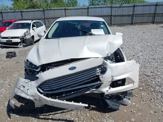 2013 Ford Fusion SE Hybrid z VIN 3FA6P0LU9DR349321, wystawiony jako IAAI lot #42156321 z przebiegiem 90 688 mil mil oraz . Historia ofert i sprzedaży dostępna na DreamBid. Obrazek 12.