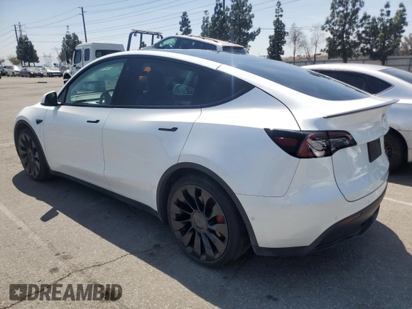 2022 Tesla Model Y Performance with VIN 7SAYGDEFXNF407340, listed as a Copart auction lot 54376895 with 56,709 mi miles and Salvage Title. Bid and sale history available at DreamBid. Image 2.