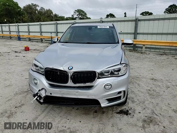 2015 BMW X5 xDrive50i with VIN 5UXKR6C51F0J74160, listed as a Copart auction lot 79337044 with 143,436 mi miles and Salvage title. Bid and sale history available at DreamBid. Image 11.