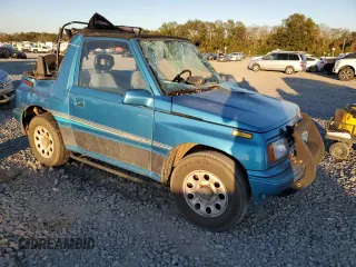 1992 Suzuki Sidekick z VIN 2S3TC01C2N6405497, wystawiony jako Copart lot #75856164 z przebiegiem 38 423 mil mil oraz Szkody całkowita. Historia ofert i sprzedaży dostępna na DreamBid. Obrazek 4.