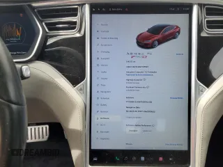 2016 Tesla Model S 90D with VIN 5YJSA1E42GF127593, listed as a Copart auction lot 52450495 with 144,151 mi miles and Salvage title. Bid and sale history available at DreamBid. Image 9.
