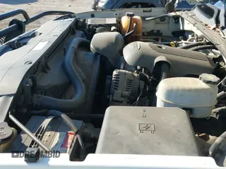 2004 Chevrolet Silverado 2500HD Work Truck z VIN 1GCHC23U14F185070, wystawiony jako IAAI lot #43422066 z przebiegiem 220 944 mil mil oraz . Historia ofert i sprzedaży dostępna na DreamBid. Obrazek 19.