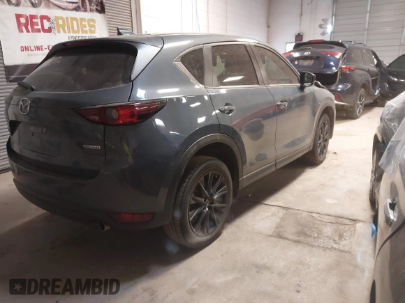2021 Mazda CX-5 Touring with VIN JM3KFACM9M0379508, listed as a IAAI auction lot 41577251 with 46,519 mi miles. Bid and sale history available at carsss.com. Image 4.