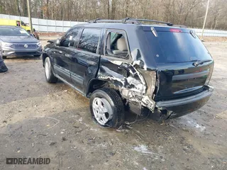 2005 Jeep Grand Cherokee Laredo with VIN 1J4GS48K85C709829, listed as a IAAI auction lot 41200259 with 1 mi miles. Bid and sale history available at carsss.com. Image 3.