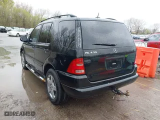 2001 Mercedes-Benz M-Class with VIN 4JGAB72E41A275216, listed as a IAAI auction lot 41953087 with 243,589 mi miles. Bid and sale history available at carsss.com. Image 3.