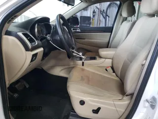 2014 Jeep Grand Cherokee Laredo with VIN 1C4RJFAG2EC132895, listed as a Copart auction lot 49311855 with 147,289 mi miles and Salvage Title. Bid and sale history available at DreamBid. Image 7.