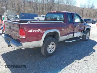 2003 Dodge Dakota SLT with VIN 1D7HG42N33S369870, listed as a IAAI auction lot 41826771 with 214,840 mi miles. Bid and sale history available at carsss.com. Image 4.