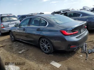 2019 BMW 3 Series 330i with VIN WBA5R1C55KAJ98853, listed as a Copart auction lot 50699315 with 101,110 mi miles and Salvage title. Bid and sale history available at DreamBid. Image 2.