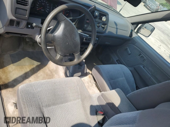 2000 Nissan Frontier XE with VIN 1N6DD26SXYC393054, listed as a Copart auction lot 62410125 with 106,319 mi miles and Salvage title. Bid and sale history available at DreamBid. Image 8.