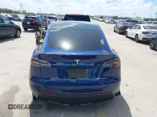 2023 Tesla Model Y Long Range with VIN 7SAYGDEE9PA205757, listed as a IAAI auction lot 41705881 with 18,567 mi miles and . Bid and sale history available at carsss.com. Image 16.