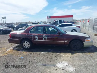2003 Mercury Grand Marquis LS Premium z VIN 2MEFM75W73X650193, wystawiony jako IAAI lot #41803310 z przebiegiem 151 719 mil mil oraz . Historia ofert i sprzedaży dostępna na DreamBid. Obrazek 13.