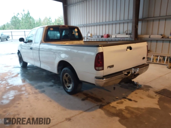 2002 Ford F-150 XL with VIN 1FTRX17L52NA38404, listed as a IAAI auction lot 41871731 with 366,564 mi miles. Bid and sale history available at carsss.com. Image 3.