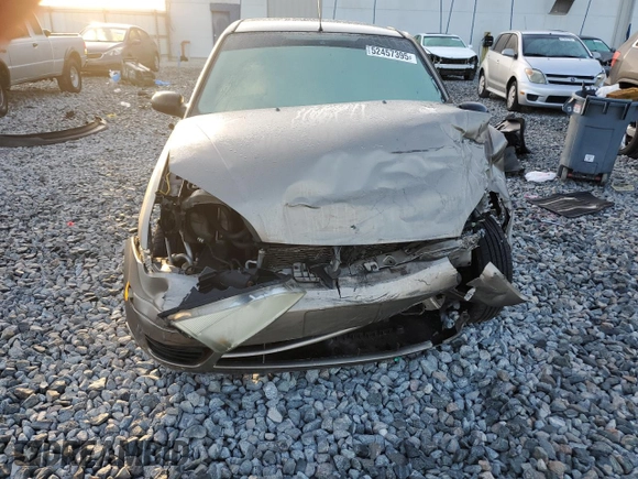 2005 Ford Focus S with VIN 1FAFP34N65W240449, listed as a Copart auction lot 52457395 with 140,246 mi miles and Non Repairable. Bid and sale history available at DreamBid. Image 5.