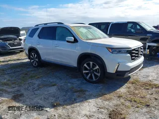 2024 Honda Pilot Elite with VIN 5FNYG1H81RB025163, listed as a IAAI auction lot 40502507 with 9,867 mi miles. Bid and sale history available at carsss.com. Image 1.