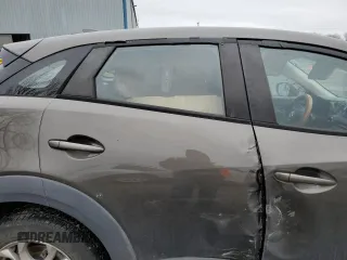 2018 Mazda CX-3 Sport z VIN JM1DKFB77J0312732, wystawiony jako Copart lot #45720065 z przebiegiem 99 866 mil mil oraz Szkoda całkowita • Salvage title. Historia ofert i sprzedaży dostępna na DreamBid. Obrazek 11.