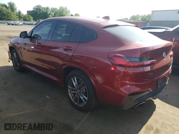 2021 BMW X4 M40i with VIN 5UX2V5C0XM9E78318, listed as a Copart auction lot 57834645 with 67,277 mi miles and Salvage title. Bid and sale history available at DreamBid. Image 2.