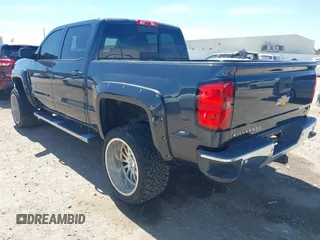 2018 Chevrolet Silverado 1500 LT with VIN 3GCPCREC1JG127396, listed as a IAAI auction lot 41790850 with 138,725 mi miles and . Bid and sale history available at DreamBid. Image 3.