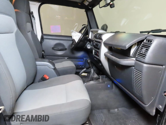 2005 Jeep Wrangler Unlimited with VIN 1J4FA44S75P305935, listed as a Copart auction lot 52035455 with 116,569 mi miles and Salvage Title. Bid and sale history available at carsss.com. Image 5.