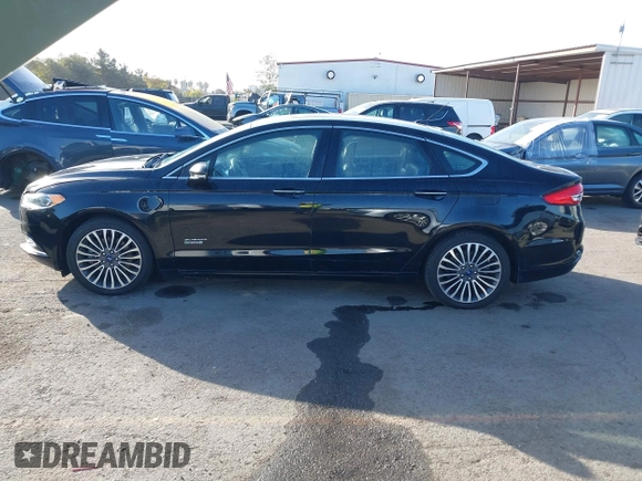 2017 Ford Fusion Energi SE with VIN 3FA6P0PU0HR129792, listed as a IAAI auction lot 41104376 with 86,659 mi miles. Bid and sale history available at carsss.com. Image 14.