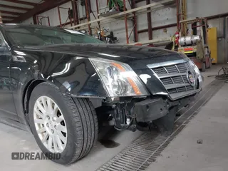 2011 Cadillac CTS Luxury with VIN 1G6DG5EYXB0145058, listed as a IAAI auction lot 41973156 with 143,246 mi miles and . Bid and sale history available at carsss.com. Image 12.