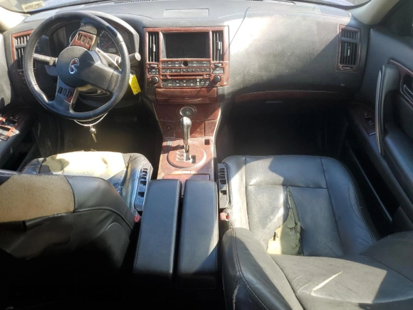 2005 Infiniti FX z VIN JNRAS08W95X216368, wystawiony jako Copart lot #54745065 z przebiegiem 232 897 mil mil oraz Szkoda całkowita • Salvage title. Historia ofert i sprzedaży dostępna na DreamBid. Obrazek 8.