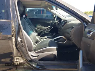 2013 Hyundai Veloster Turbo w/Black Int with VIN KMHTC6AE8DU175611, listed as a IAAI auction lot 42057549 with 137,929 mi miles. Bid and sale history available at carsss.com. Image 5.