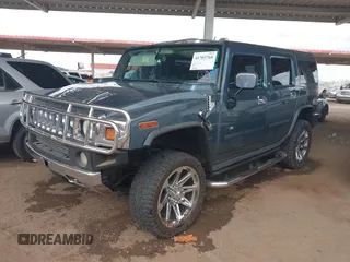 2005 Hummer H2 SUV with VIN 5GRGN23U25H107505, listed as a IAAI auction lot 41703768 with 213,723 mi miles. Bid and sale history available at carsss.com. Image 2.