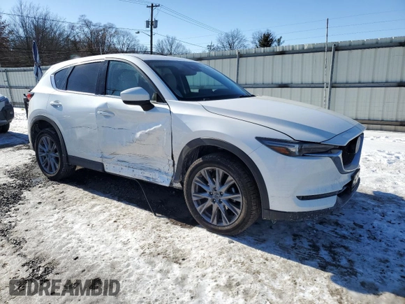 2021 Mazda CX-5 Grand Touring with VIN JM3KFBDM3M1305807, listed as a Copart auction lot 42713655 with 58,162 mi miles and Salvage Title. Bid and sale history available at DreamBid. Image 4.